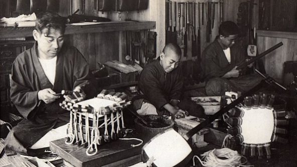 Shamisen_maker’s_Workshop_in_Japan_(1915_by_Elstner_Hilton)